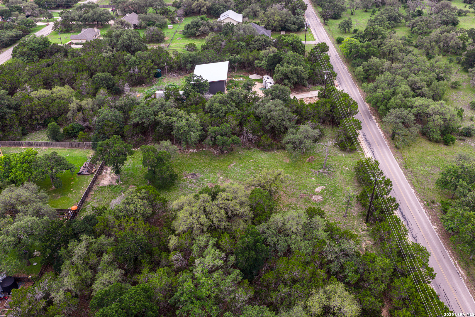 5742 Spring Branch Road Spring Branch, TX 78070 - Photo 21 of 39 a aerial view of a house with a yard