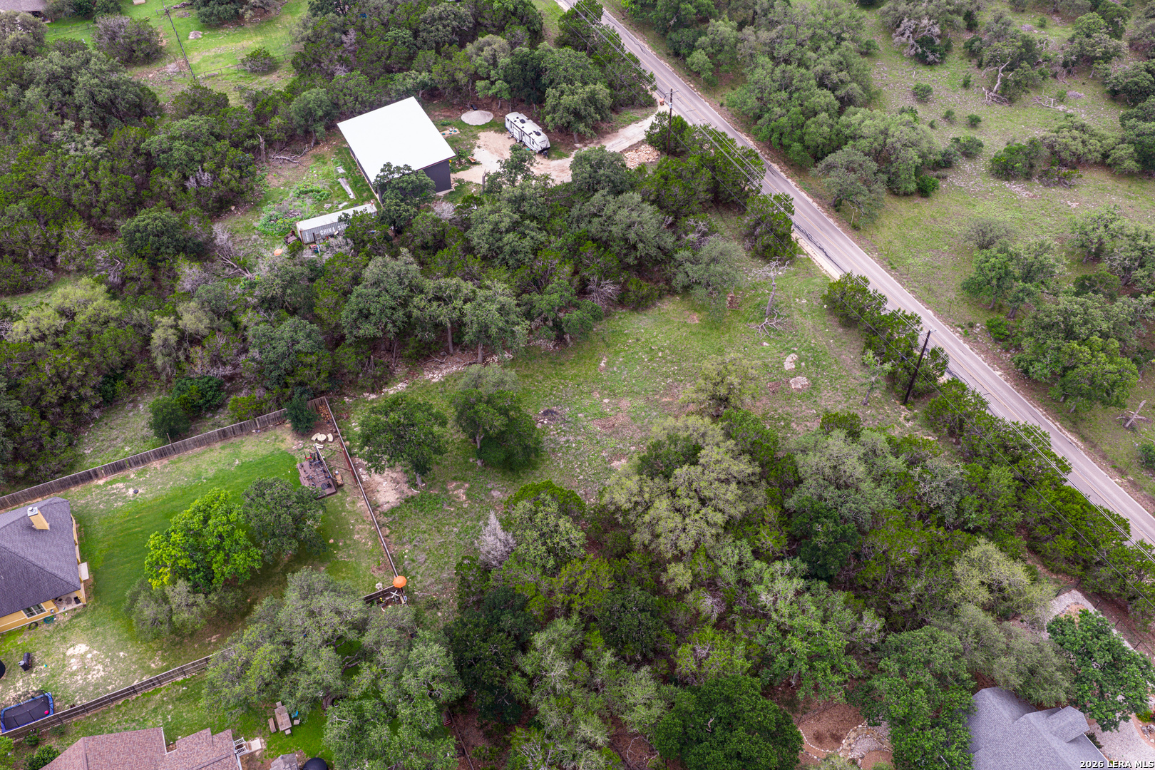 5742 Spring Branch Road Spring Branch, TX 78070 - Photo 27 of 39 an aerial view of residential house with outdoor space and trees all around
