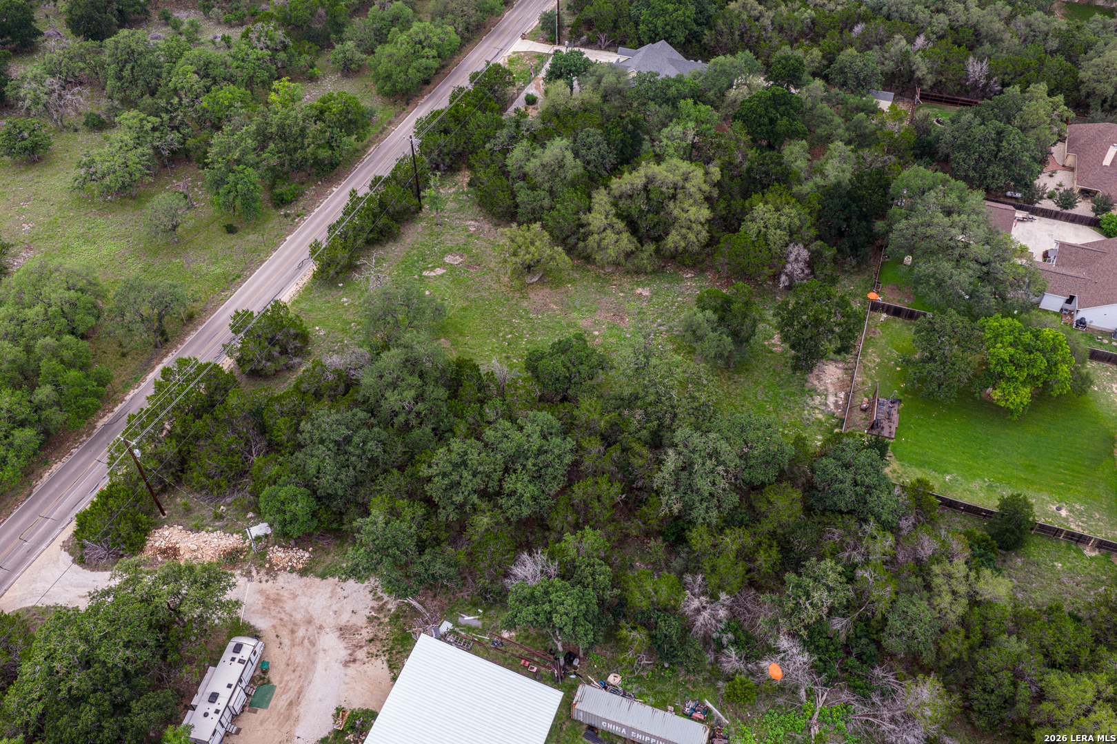 5742 Spring Branch Road Spring Branch, TX 78070 - Photo 28 of 39 an aerial view of residential houses with outdoor space and trees