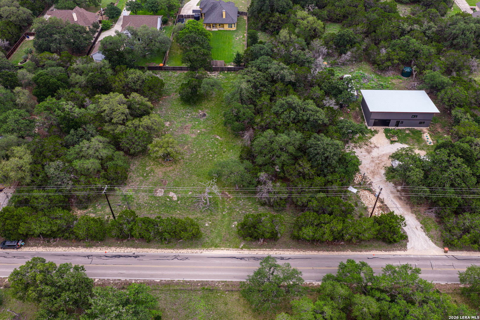 5742 Spring Branch Road Spring Branch, TX 78070 - Photo 29 of 39 a view of a street with a bench