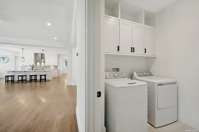 a view of living room with furniture and wooden floor
