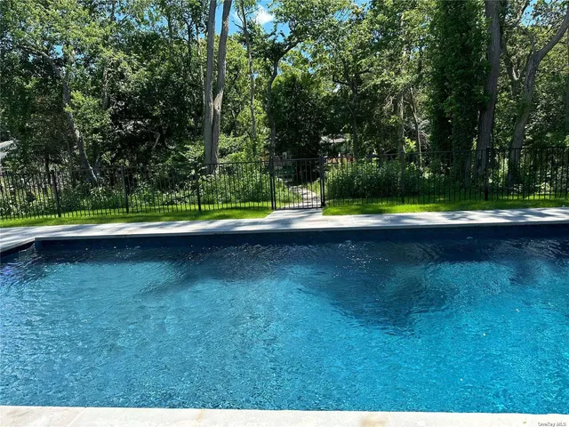 a view of swimming pool with a yard