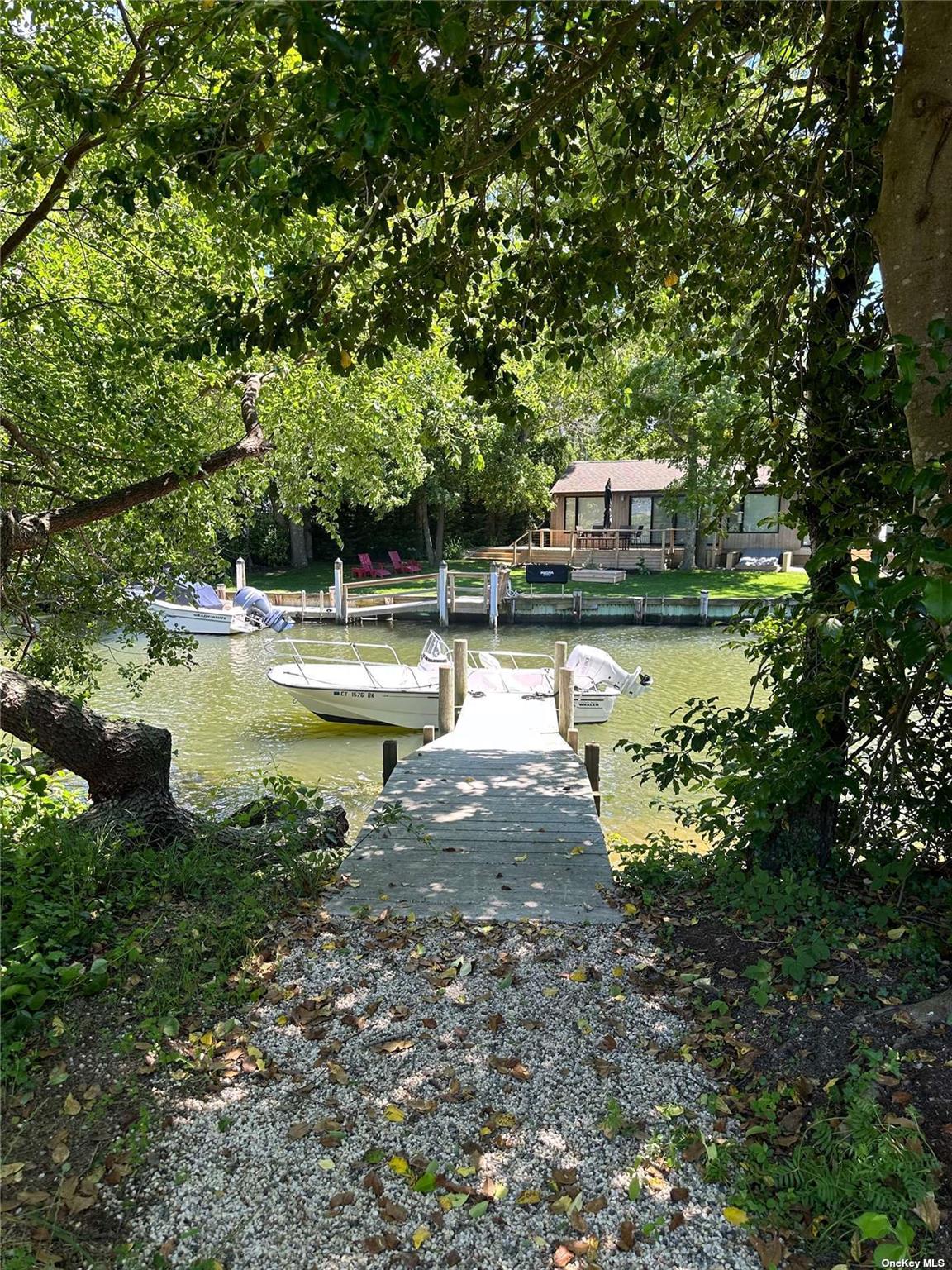 910 Glenn Road Southold, NY 11971 - Photo 31 of 33 a view of a swimming pool with a patio