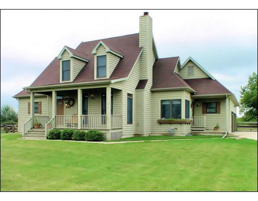 4371 East 2925th Road Sheridan, IL 60551 - Photo 1 of 1 a view of a white house with a big yard and potted plants