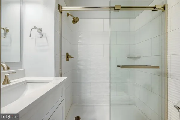 a bathroom with a shower and a sink