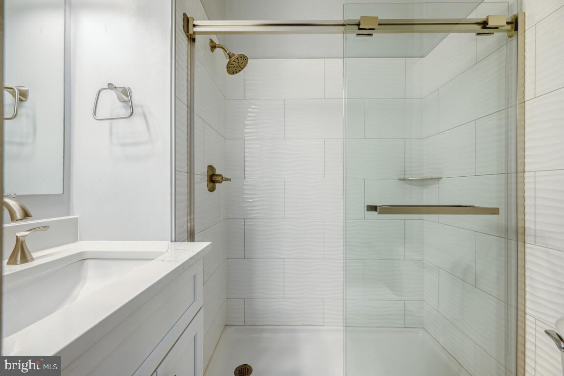 7222 Brookfalls Terrace Baltimore, MD 21209 - Photo 10 of 17 a bathroom with a shower and a sink