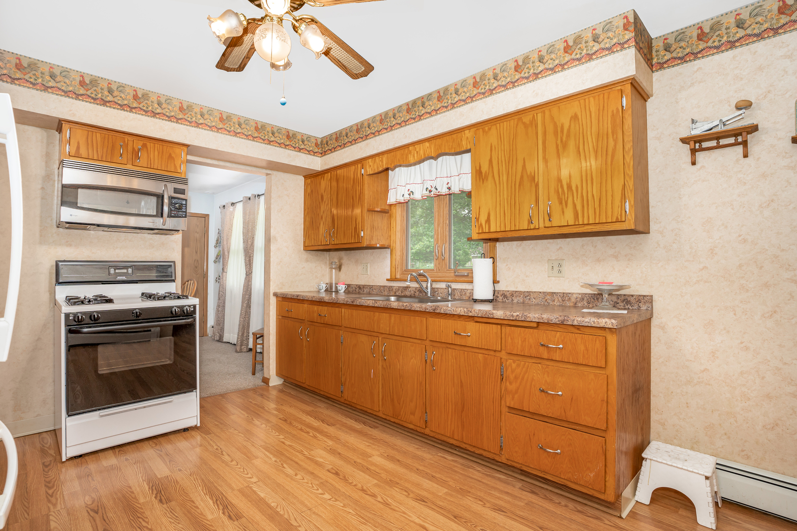 11025 Bryant Road Mokena, IL 60448 - Photo 9 of 21 a kitchen with stainless steel appliances granite countertop a sink and a refrigerator