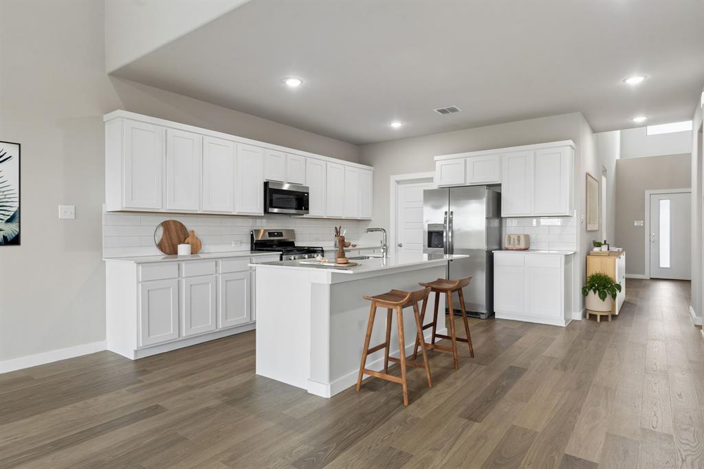 2303 Wind River Road Princeton, TX 75407 - Photo 5 of 32 Kitchen in the Winters home plan by Trophy Signature Homes – REPRESENTATIVE PHOTO