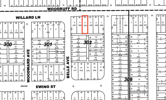 a black and white photo of a black gate