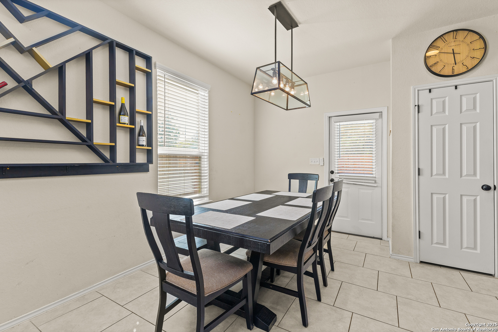 1447 Polydora San Antonio, TX 78245 - Photo 12 of 33 a view of a dining room with furniture window and wooden floor
