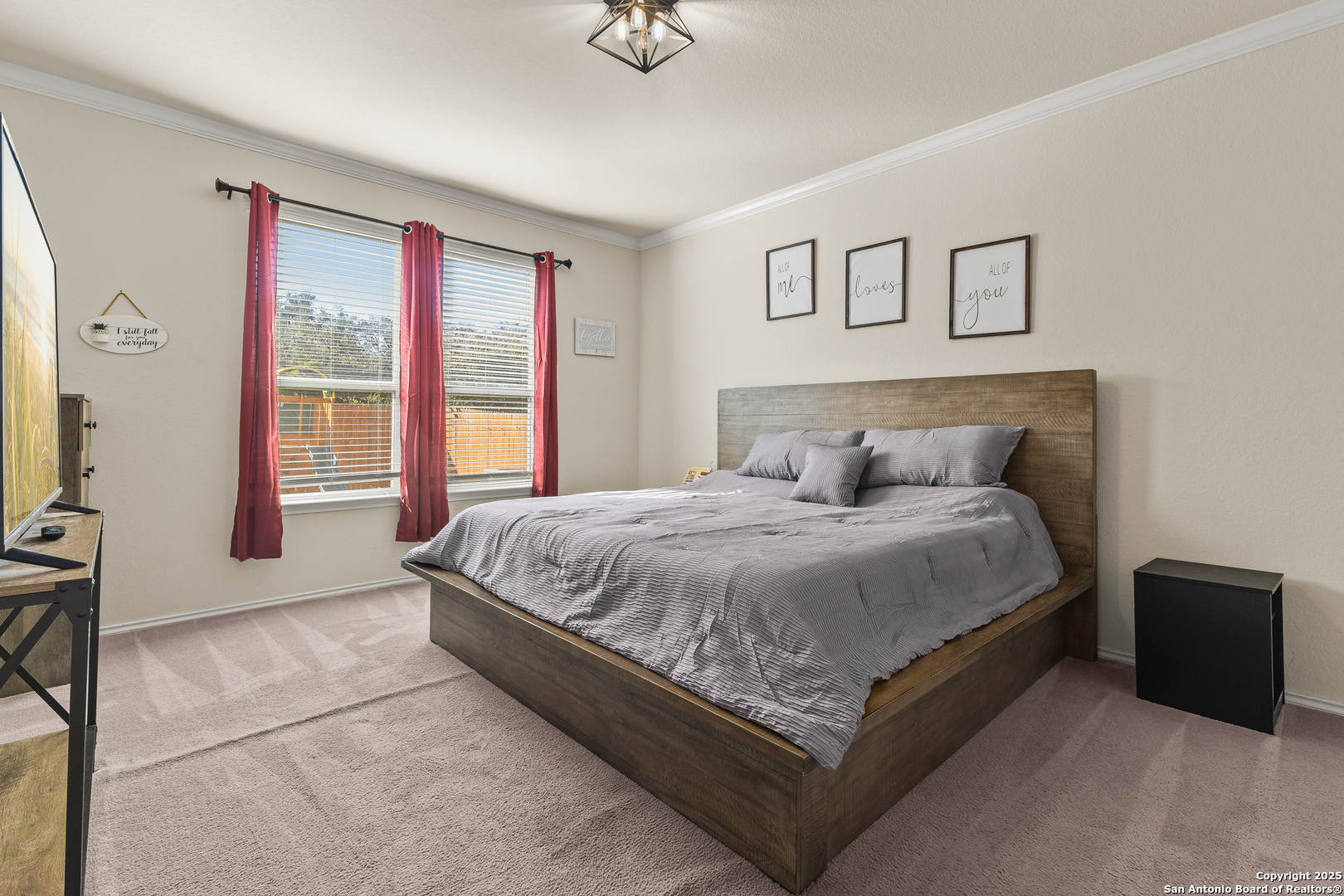 1447 Polydora San Antonio, TX 78245 - Photo 18 of 33 a spacious bedroom with a bed and glass windows