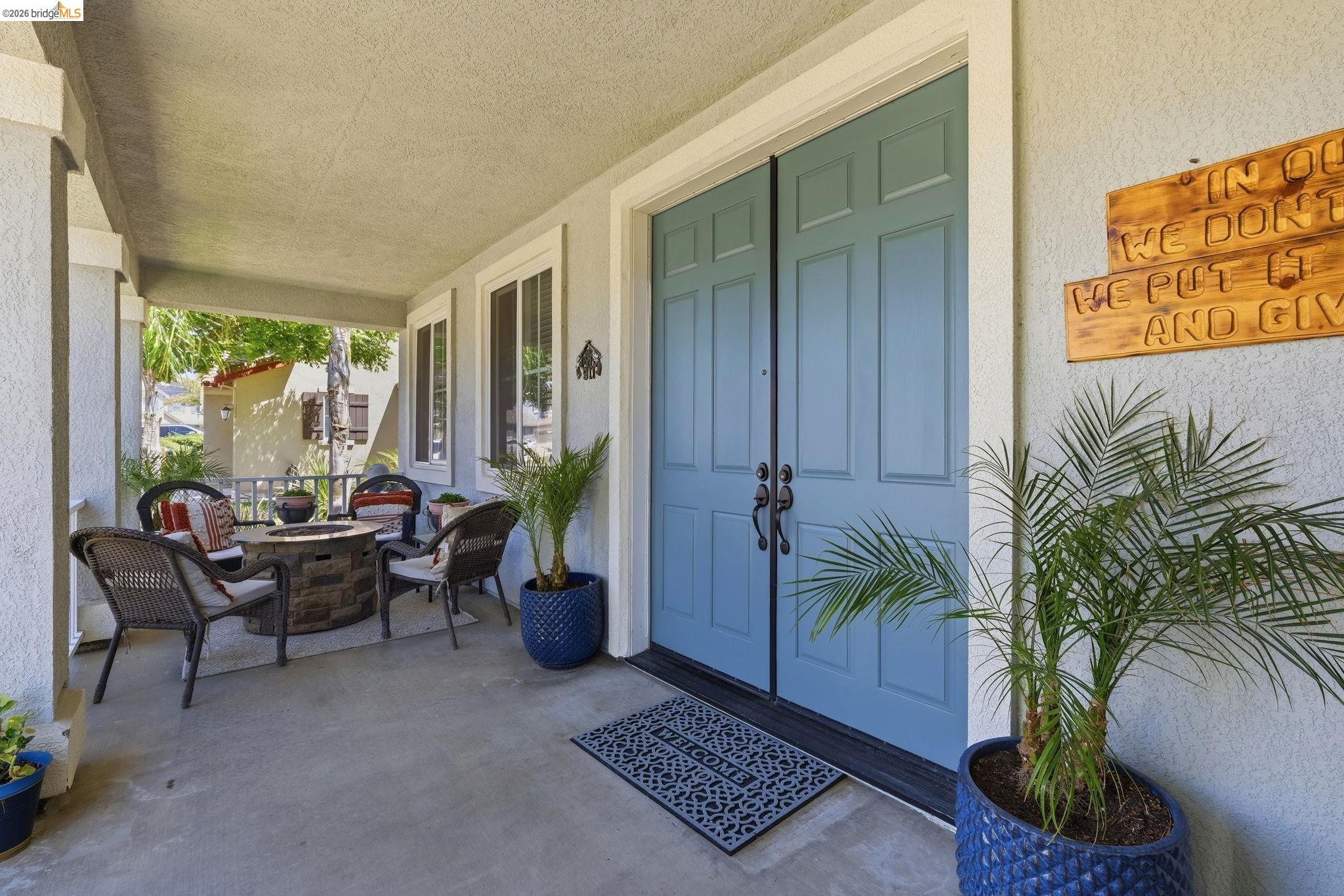 3438 Keystone Loop Discovery Bay, CA 94505 - Photo 6 of 57 Covered front porch featuring concrete flooring and stucco pillars