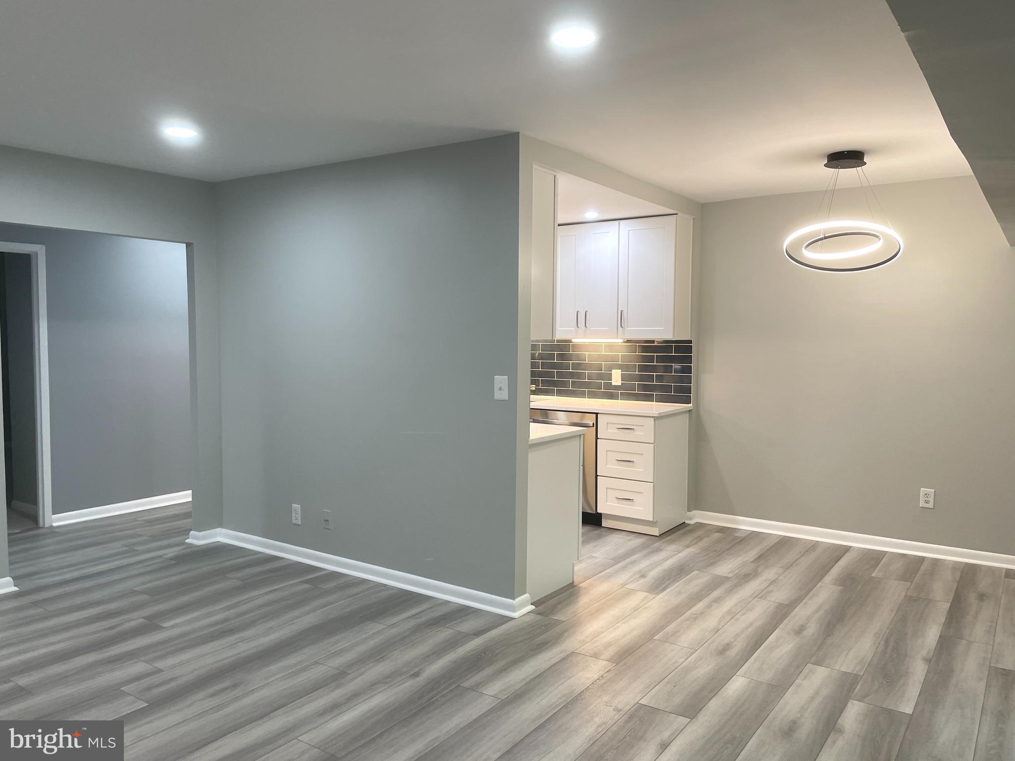 2214 Castle Rock Square, Unit 22C Reston, VA 20191 - Photo 13 of 32 Corner view of LIVING RM, DINING RM and KITCHEN