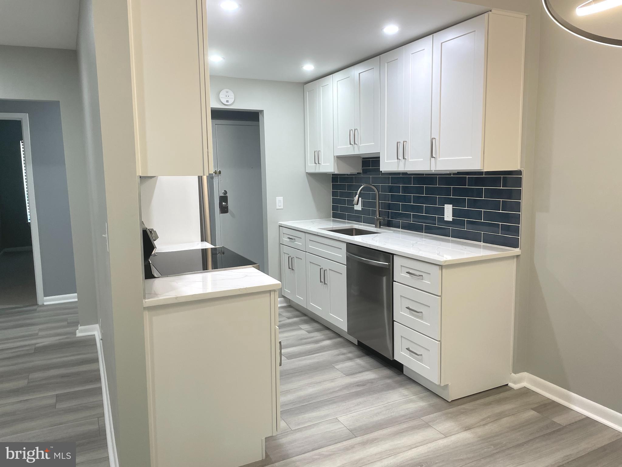 2214 Castle Rock Square, Unit 22C Reston, VA 20191 - Photo 6 of 32 KITCHEN with new appliances, cabinets,
& sink