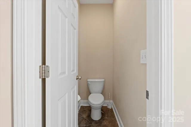 a view of a livingroom with workspace and a window