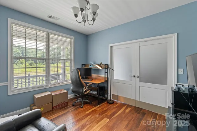 a bedroom with furniture and a window