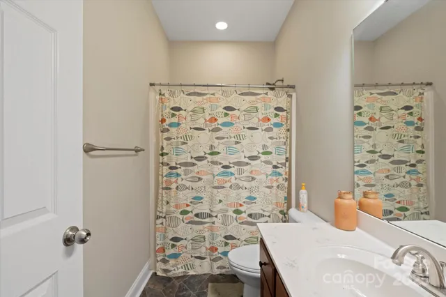 a room with furniture a rug and a window