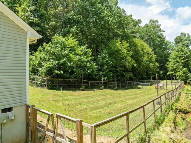a view of a swimming pool with a yard
