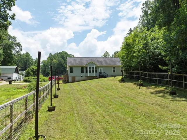 a swimming pool with some trees in the background