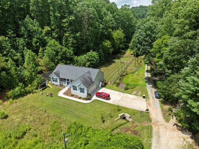 an aerial view of residential house with outdoor space
