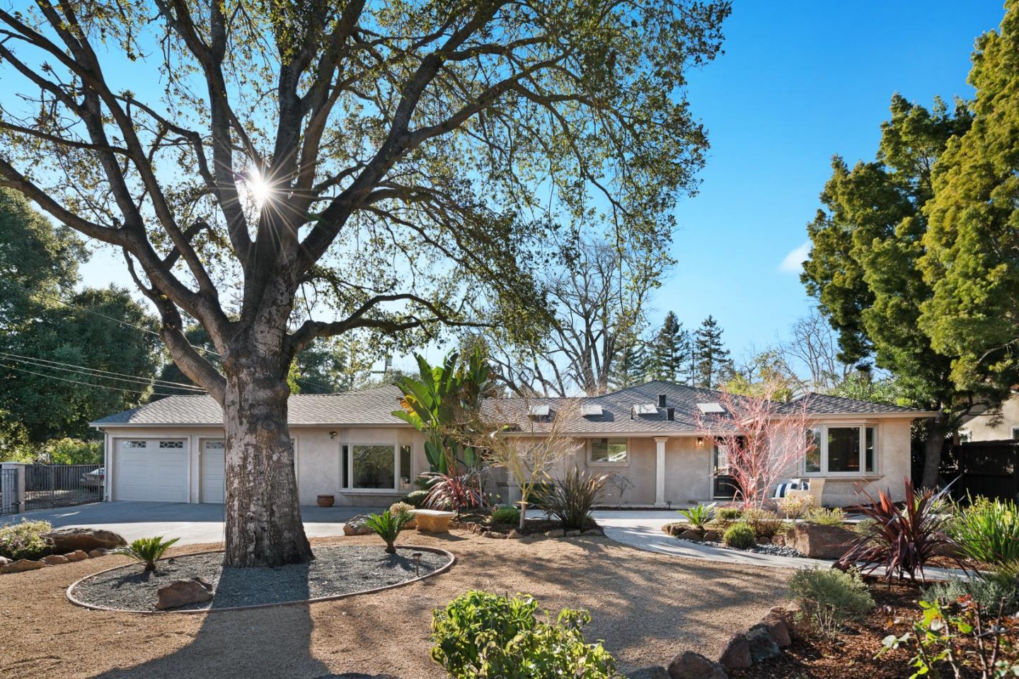 13685 Quito Road Saratoga, CA 95070 - Photo 1 of 20 a front view of a house with patio