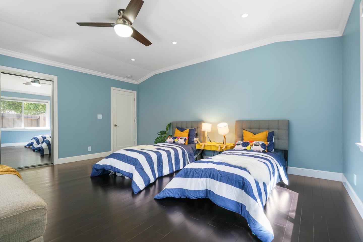 13685 Quito Road Saratoga, CA 95070 - Photo 13 of 20 a bedroom with two beds and a chandelier