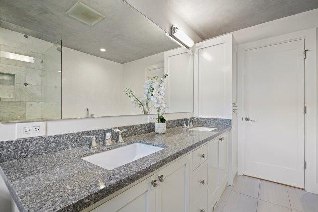 13685 Quito Road Saratoga, CA 95070 - Photo 17 of 20 a bathroom with a granite countertop sink and a mirror