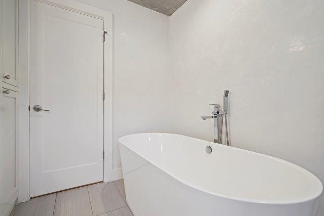 13685 Quito Road Saratoga, CA 95070 - Photo 18 of 20 a white bath tub sitting in a bathroom