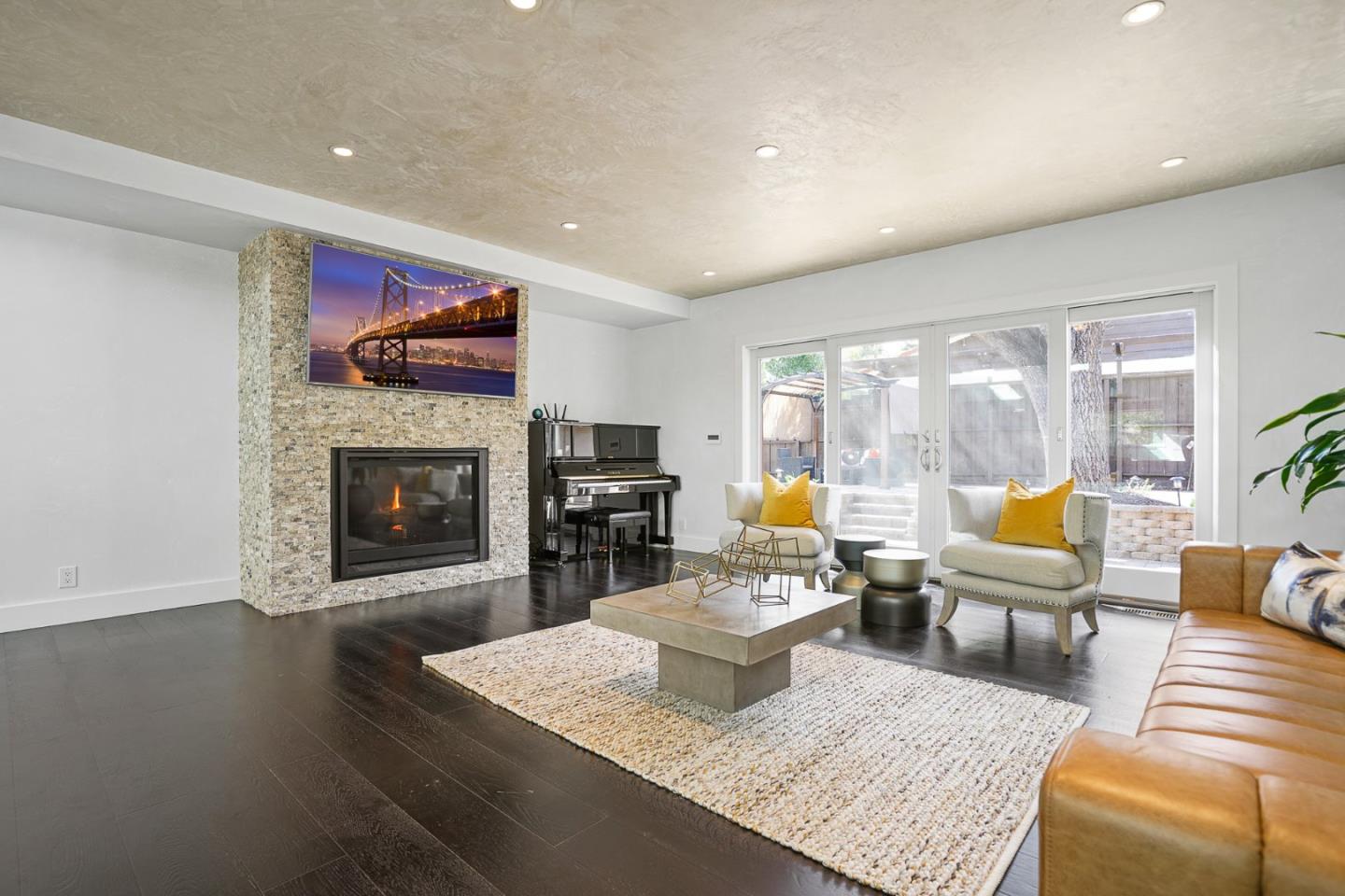 13685 Quito Road Saratoga, CA 95070 - Photo 5 of 20 a living room with furniture and a fireplace