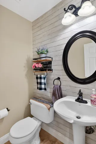 a kitchen with granite countertop white cabinets and stainless steel appliances