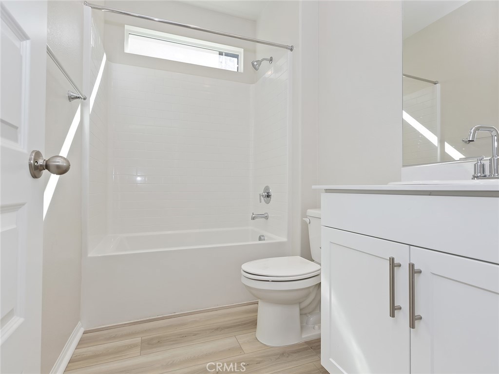 19557 Hanging Rock Road Lake Elsinore, CA 92532 - Photo 11 of 54 a bathroom with a sink a toilet and shower