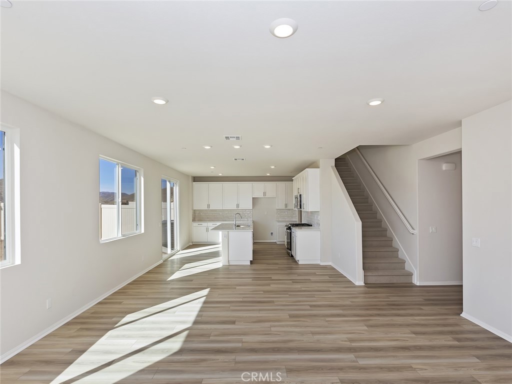 19557 Hanging Rock Road Lake Elsinore, CA 92532 - Photo 16 of 54 a view of kitchen with furniture and wooden floor
