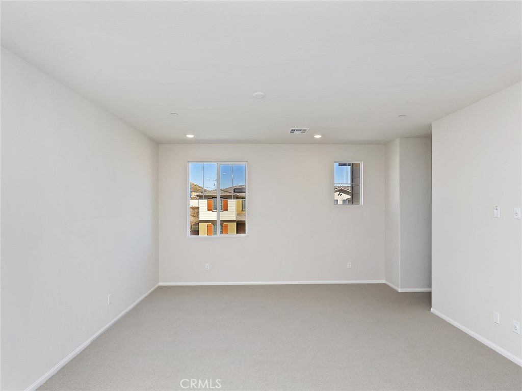 19557 Hanging Rock Road Lake Elsinore, CA 92532 - Photo 25 of 54 a view of an empty room with a window