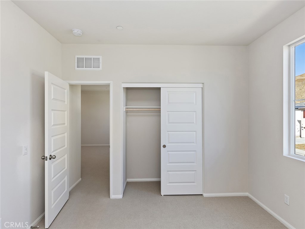 19557 Hanging Rock Road Lake Elsinore, CA 92532 - Photo 28 of 54 wooden floor in an empty room
