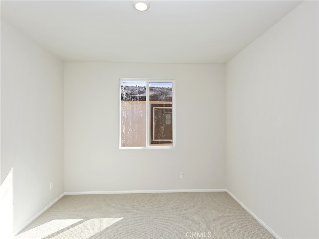 19557 Hanging Rock Road Lake Elsinore, CA 92532 - Photo 29 of 54 a view of an empty room with a window
