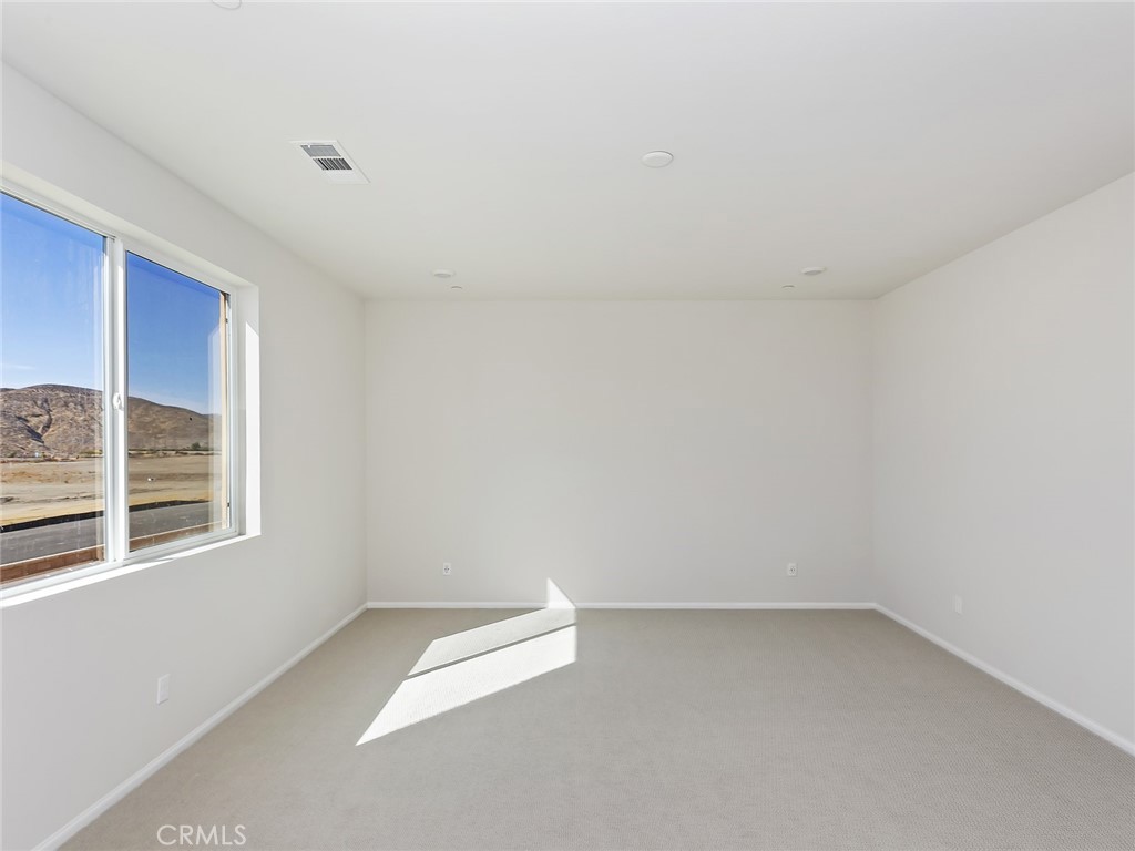 19557 Hanging Rock Road Lake Elsinore, CA 92532 - Photo 36 of 54 a view of an empty room with a window