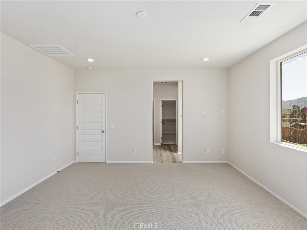 19557 Hanging Rock Road Lake Elsinore, CA 92532 - Photo 37 of 54 an empty room with windows