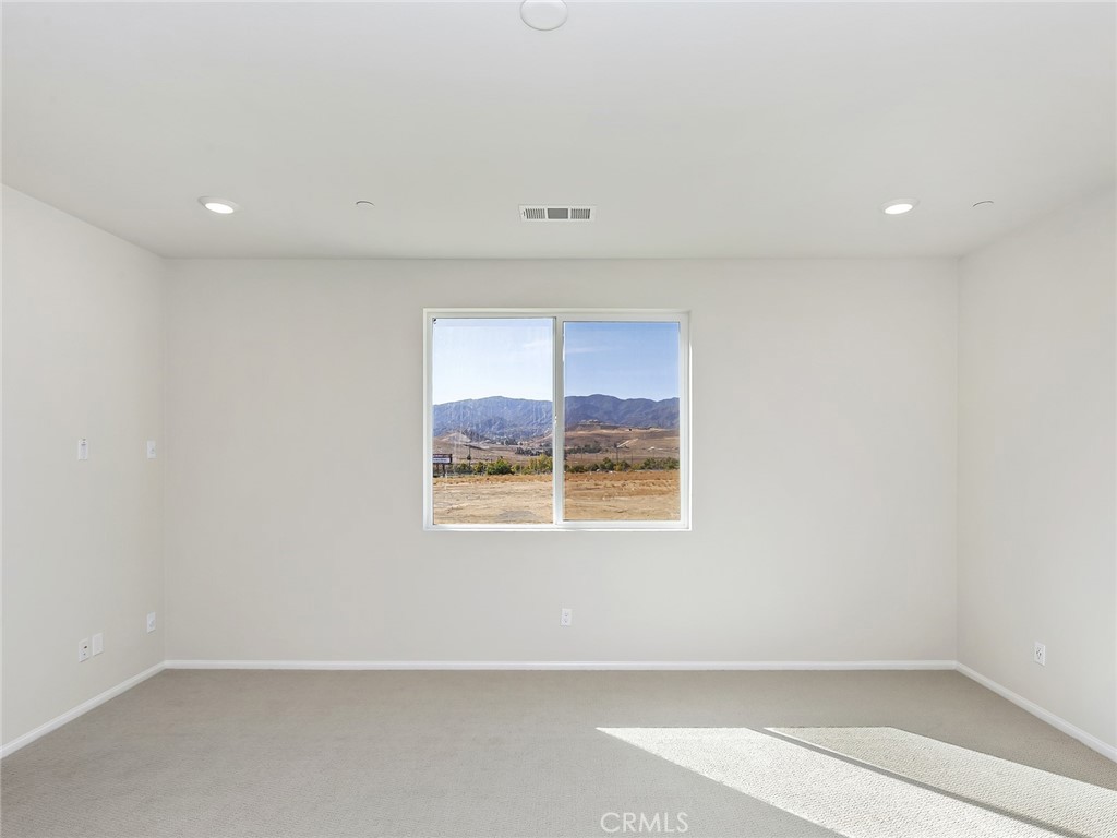 19557 Hanging Rock Road Lake Elsinore, CA 92532 - Photo 38 of 54 an empty room with a window