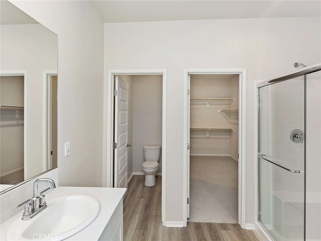19557 Hanging Rock Road Lake Elsinore, CA 92532 - Photo 41 of 54 a bathroom with a sink and a mirror