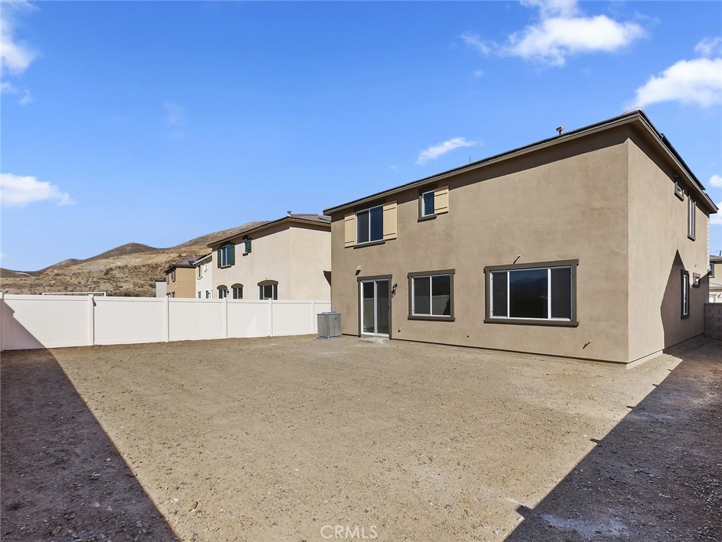 19557 Hanging Rock Road Lake Elsinore, CA 92532 - Photo 50 of 54 a front view of a house with a yard