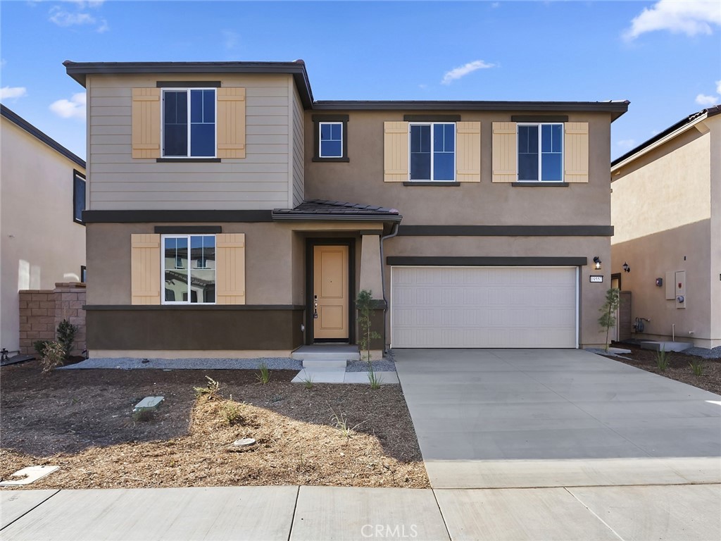 19557 Hanging Rock Road Lake Elsinore, CA 92532 - Photo 5 of 54 a front view of a house