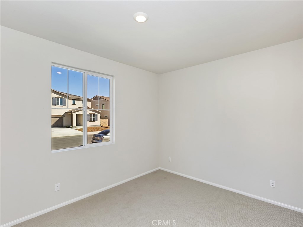 19557 Hanging Rock Road Lake Elsinore, CA 92532 - Photo 8 of 54 an empty room with a window