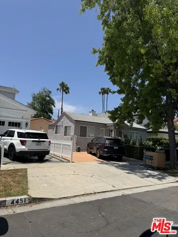 a view of street with parked cars