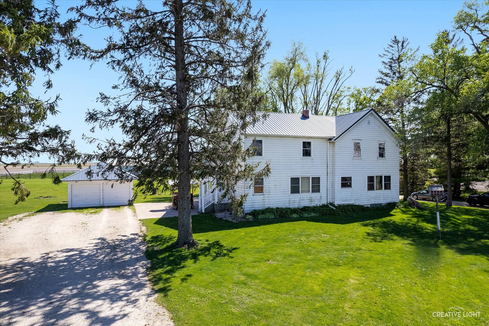3537 Gurler Road Steward, IL 60553 - Photo 1 of 29 a front view of a house with a yard and trees
