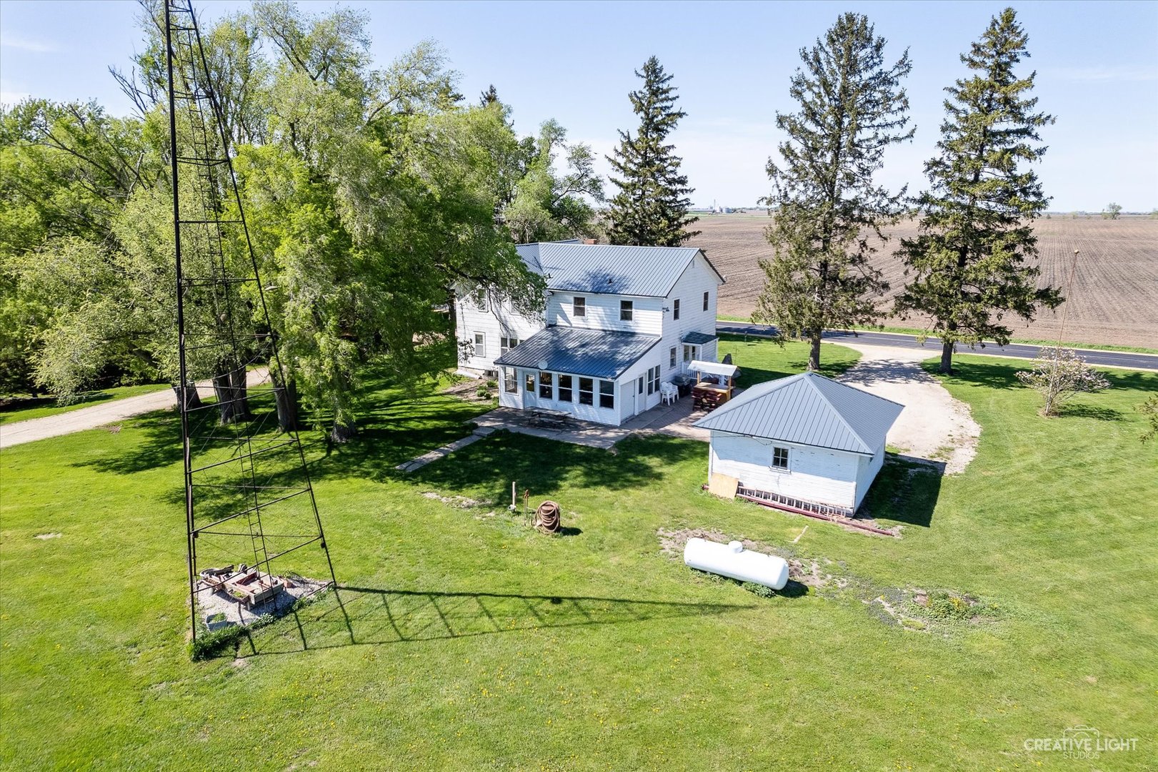 3537 Gurler Road Steward, IL 60553 - Photo 3 of 29 an aerial view of a house with swimming pool garden and large trees