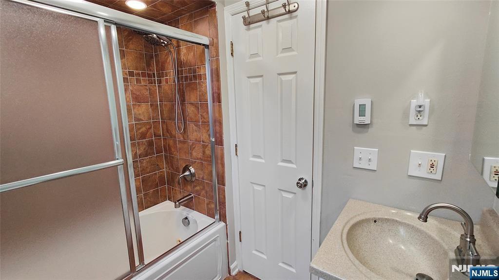 8 Sewall Avenue, Unit B Clifton, NJ 07011 - Photo 15 of 22 a bathroom with a shower and a sink