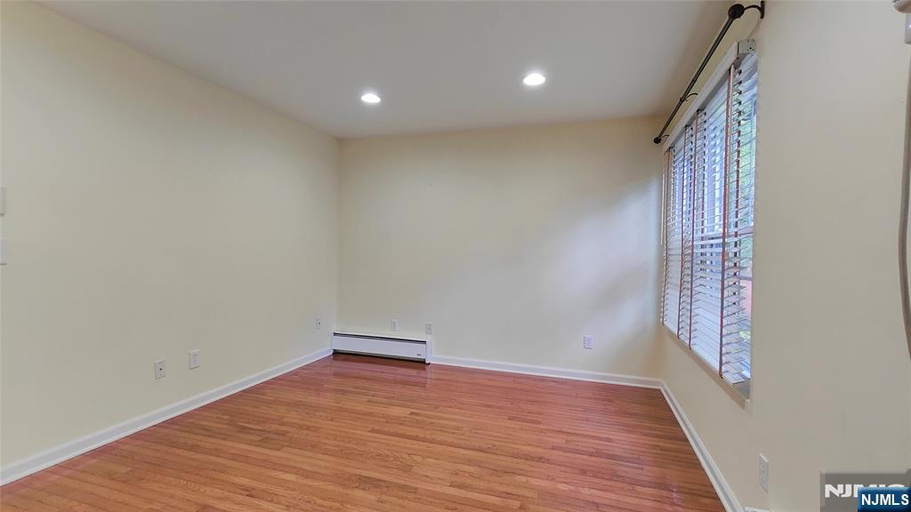 8 Sewall Avenue, Unit B Clifton, NJ 07011 - Photo 16 of 22 a view of room with wooden floor