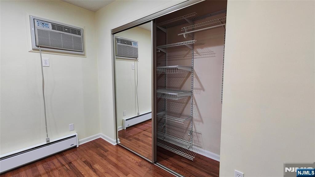 8 Sewall Avenue, Unit B Clifton, NJ 07011 - Photo 20 of 22 a walk in closet with wooden floor