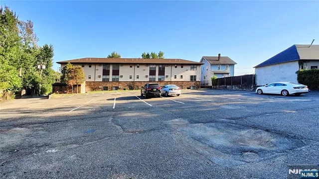 a view of a street with cars on road
