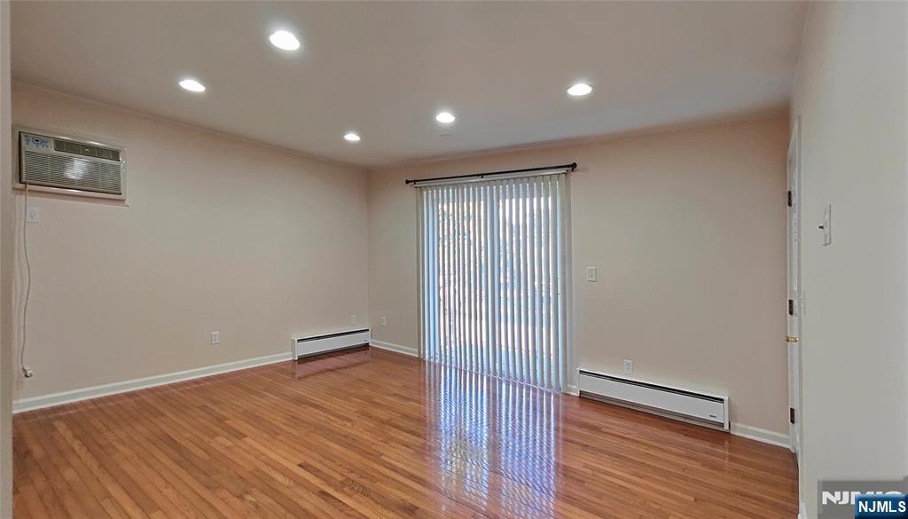 8 Sewall Avenue, Unit B Clifton, NJ 07011 - Photo 10 of 22 a view of a room with wooden floor